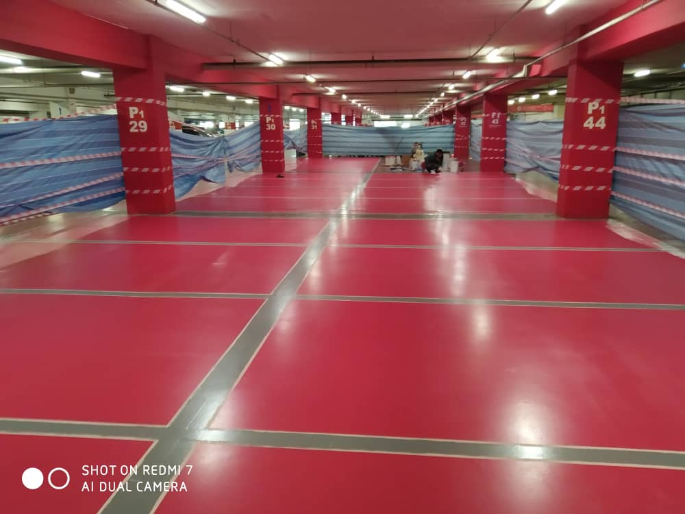 Red epoxy-coated parking bays at Tesco Kepong.